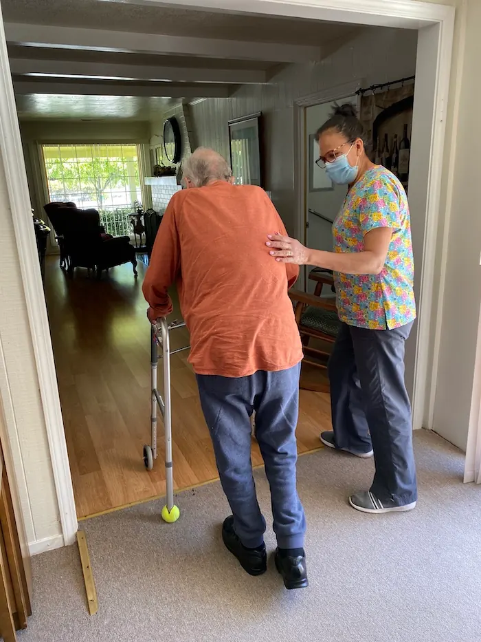 caregiver assisting elderly